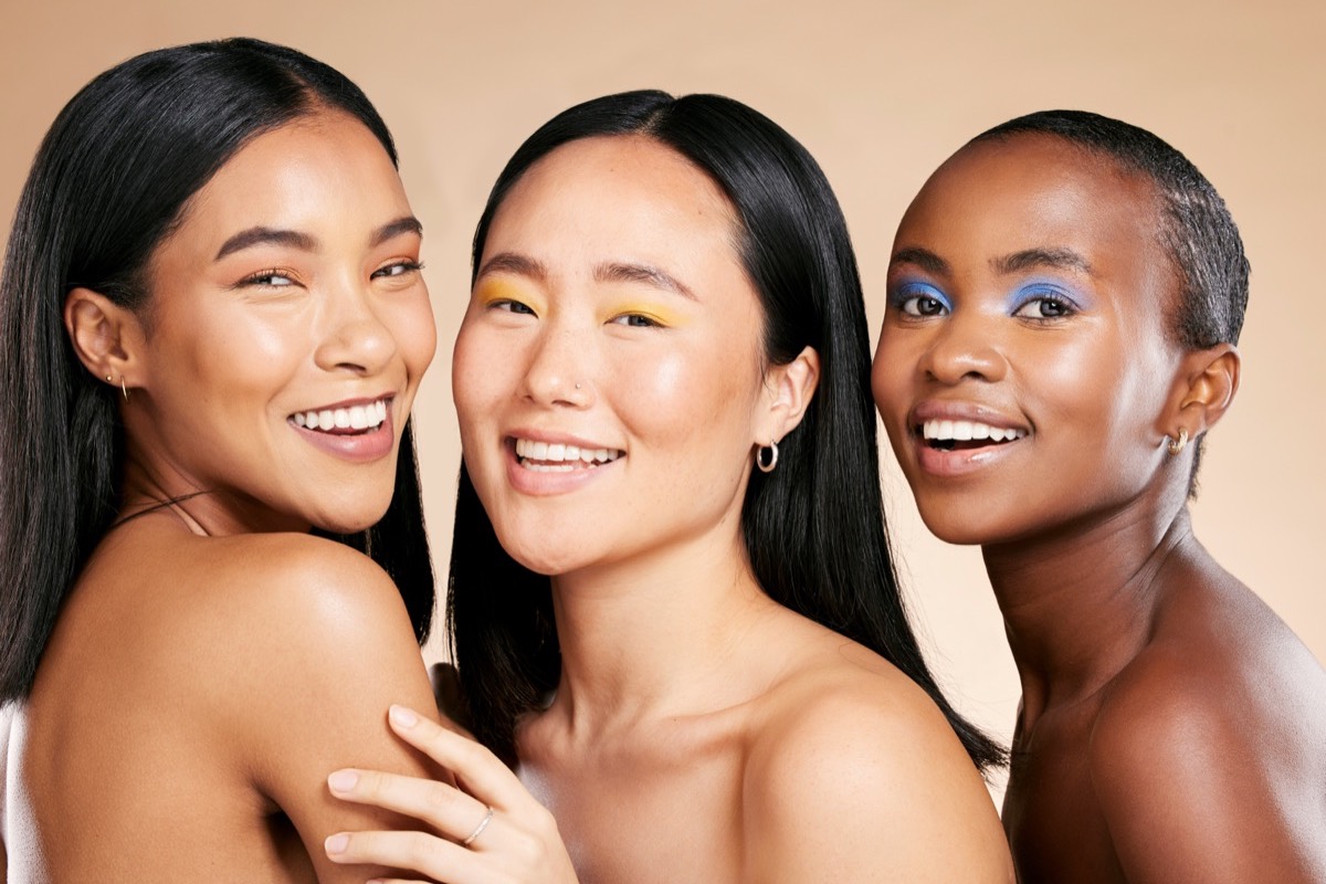 Friends comparing skincare in a studio