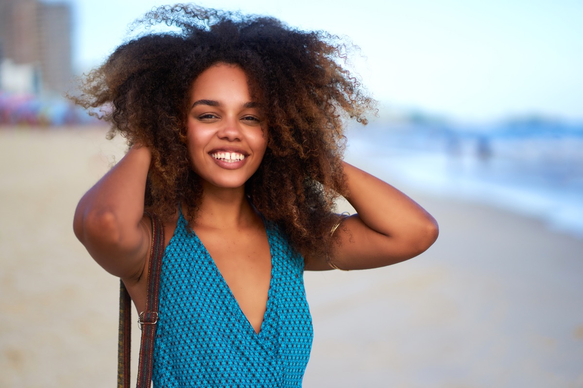 Smiling woman with healthy, sun-protected skin